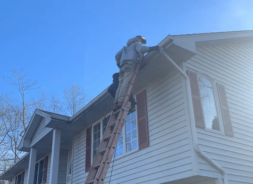 Gutter cleaning and maintenance being performed by Westlake Power Washing in Westlake